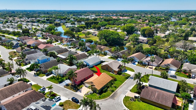 birds eye view of property with a residential view