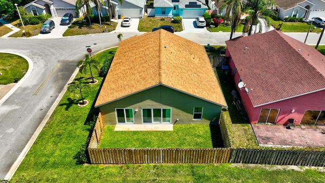 birds eye view of property with a residential view