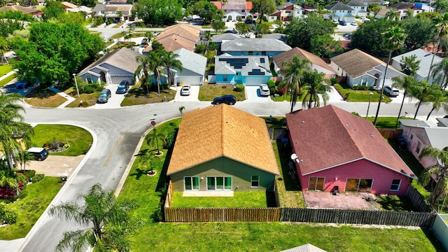 birds eye view of property with a residential view