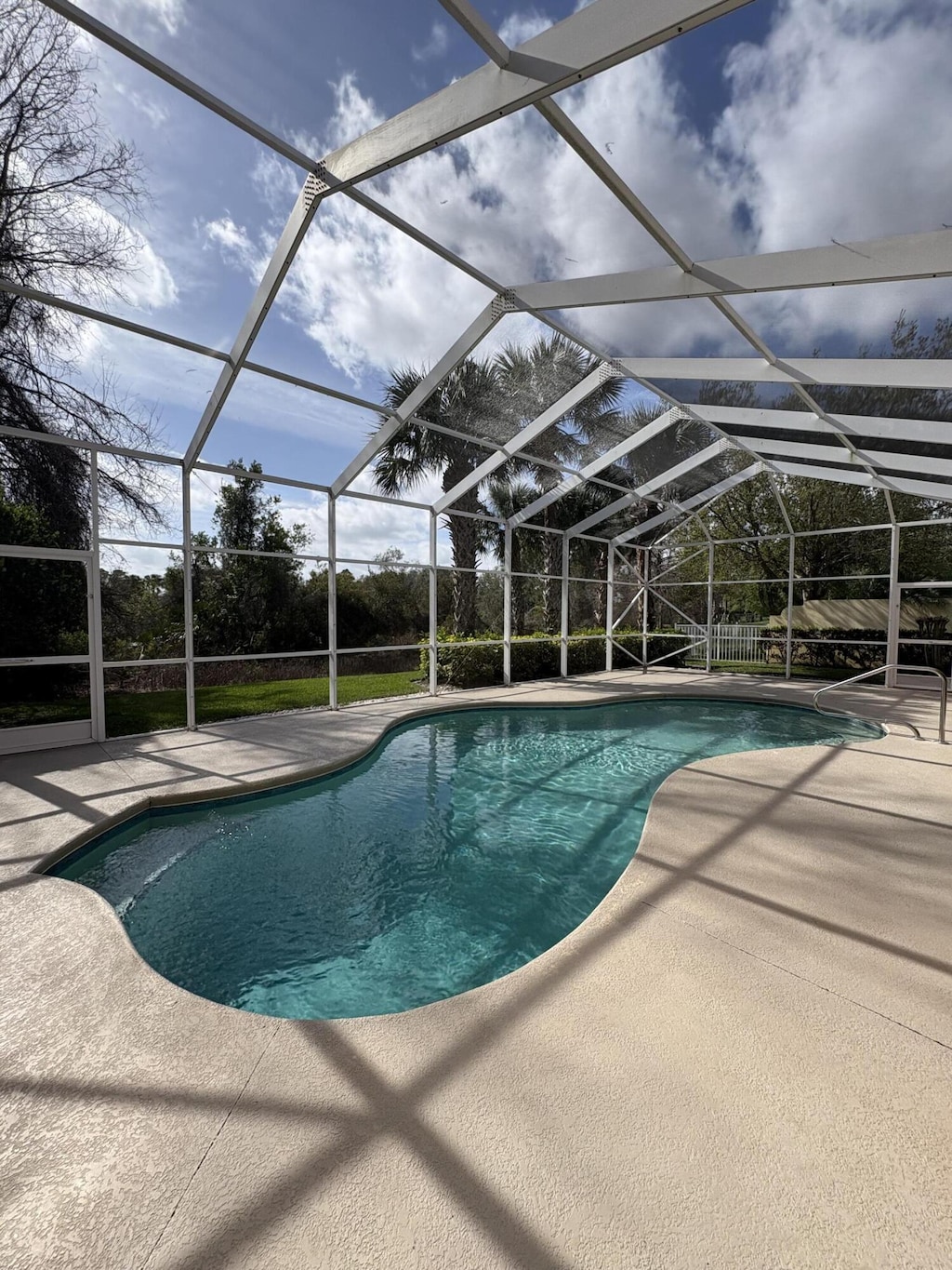 pool featuring a patio and a lanai