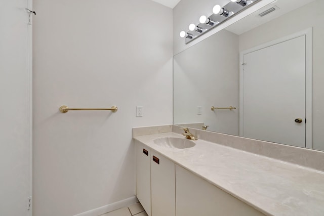 bathroom with tile patterned floors, visible vents, baseboards, and vanity