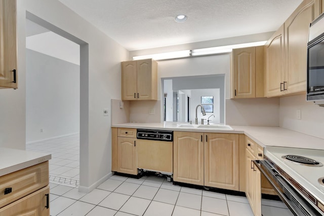 kitchen with dishwashing machine, light brown cabinets, black microwave, and a sink