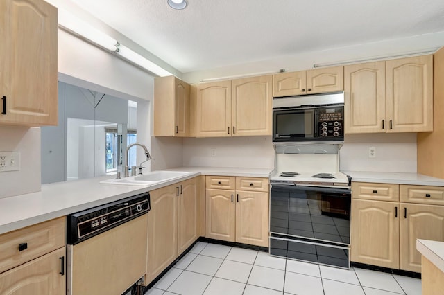 kitchen with dishwashing machine, a sink, electric range oven, light brown cabinetry, and black microwave