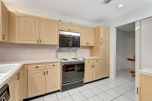 kitchen with light brown cabinets, light countertops, black microwave, range with electric stovetop, and dishwasher