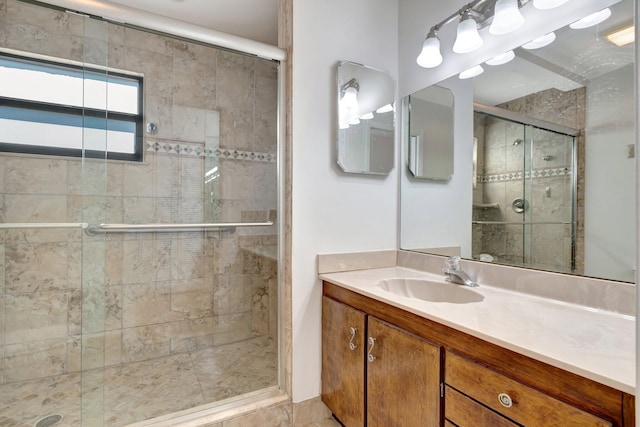 full bath with a shower stall and vanity