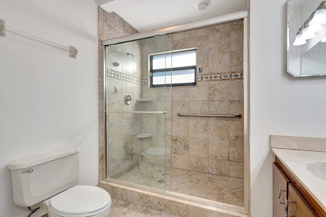 full bathroom with vanity, toilet, and a shower stall