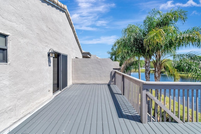 wooden terrace with a water view