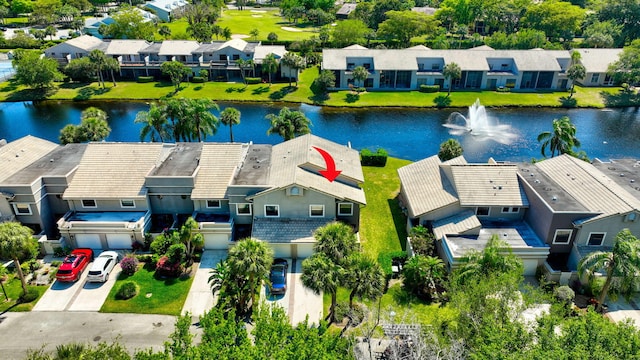 birds eye view of property with a residential view and a water view