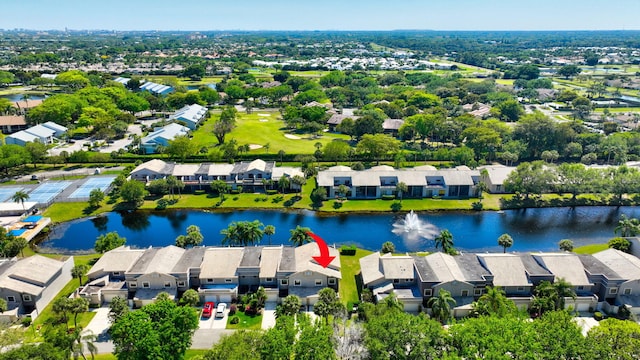 drone / aerial view with a residential view and a water view