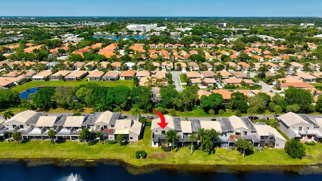 bird's eye view with a residential view and a water view