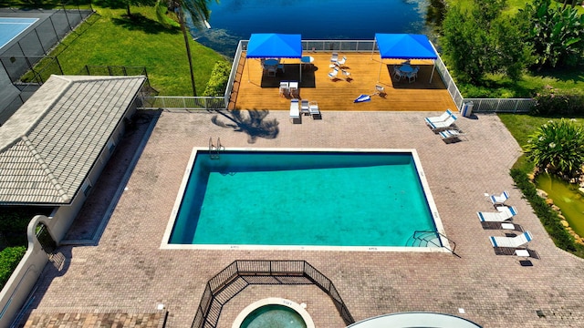 community pool featuring a patio area and fence