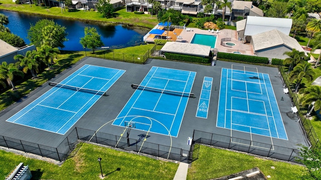 birds eye view of property featuring a water view and a residential view