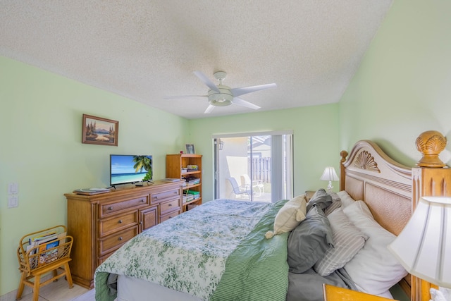 bedroom featuring a textured ceiling, ceiling fan, and access to outside