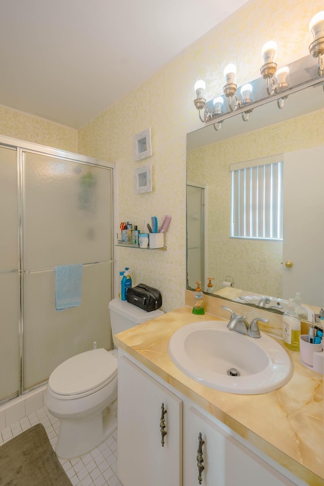 full bath with wallpapered walls, toilet, a stall shower, tile patterned floors, and vanity