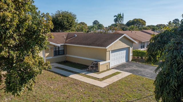 ranch-style house featuring a shingled roof, aphalt driveway, a garage, and stucco siding