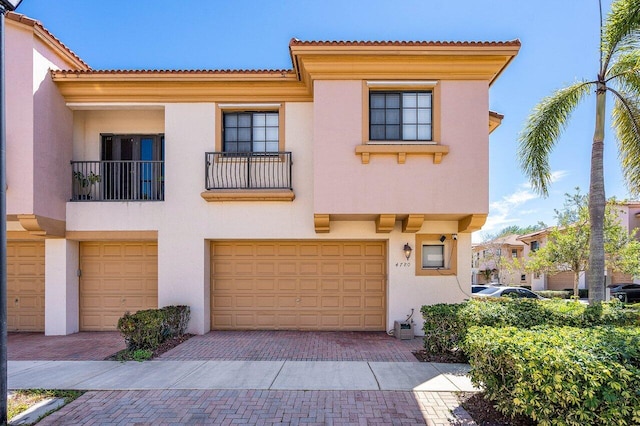 4780 Grand Cypress Cir N, Coconut Creek, FL 33073 - mediterranean / spanish home featuring stucco siding, a garage, and decorative driveway