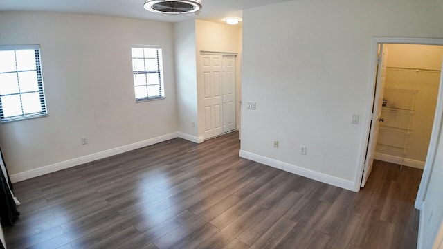 4780 Grand Cypress Cir N, Coconut Creek, FL 33073 - unfurnished bedroom with dark wood-type flooring and a closet