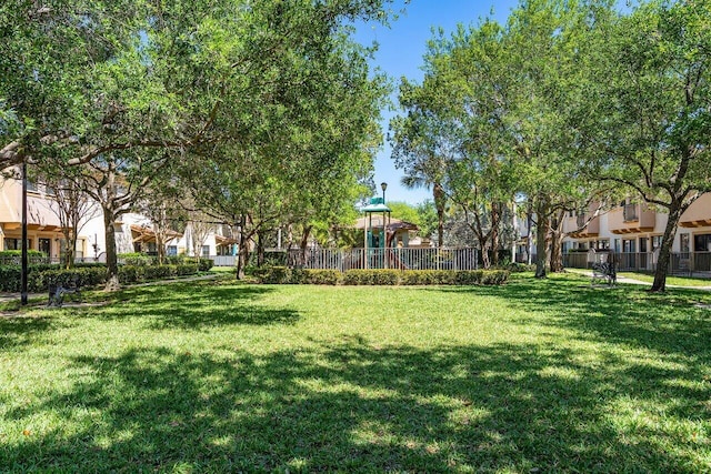 view of yard featuring fence and a residential view