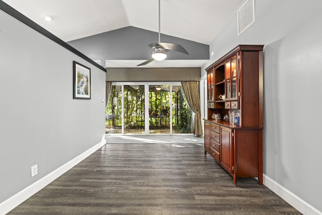 interior space with dark wood finished floors, baseboards, and visible vents