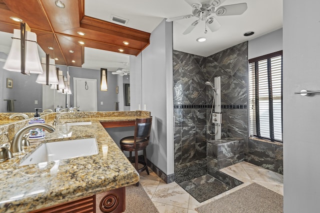 full bath featuring a ceiling fan, visible vents, double vanity, a sink, and a walk in shower