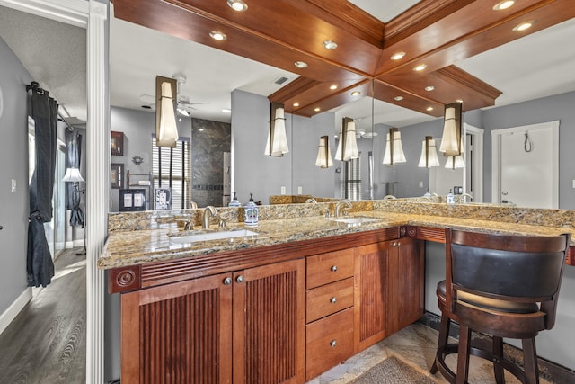 full bath with double vanity, recessed lighting, ceiling fan, and a sink