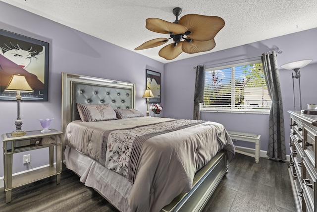 bedroom with ceiling fan, baseboards, a textured ceiling, and dark wood finished floors