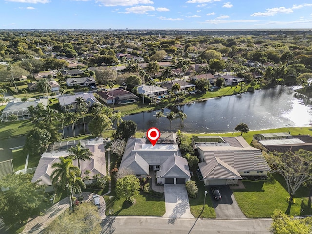 drone / aerial view featuring a residential view and a water view