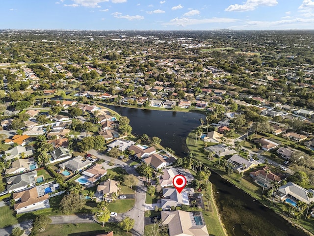 drone / aerial view with a residential view and a water view