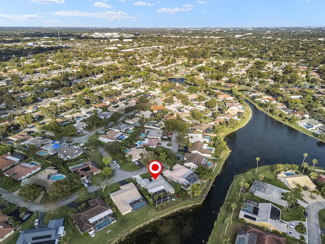 bird's eye view featuring a residential view and a water view