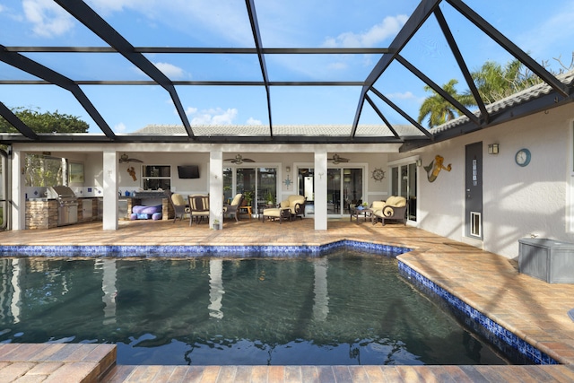 pool featuring a patio, exterior kitchen, an outdoor living space, ceiling fan, and a lanai