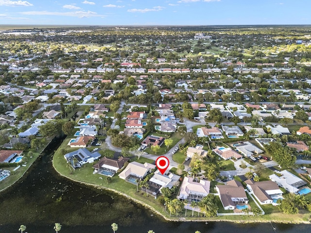 birds eye view of property featuring a residential view and a water view