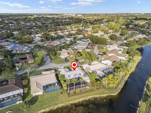 birds eye view of property featuring a residential view and a water view