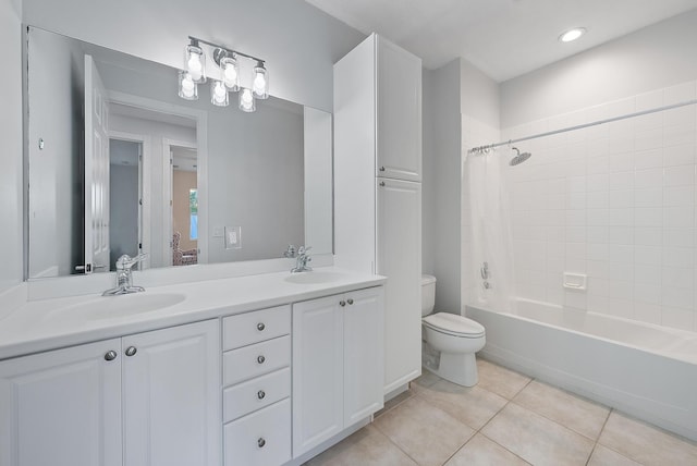 full bath with a sink, toilet, ensuite bath, and tile patterned flooring