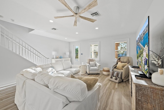 living area with recessed lighting, visible vents, light wood-style flooring, and ceiling fan