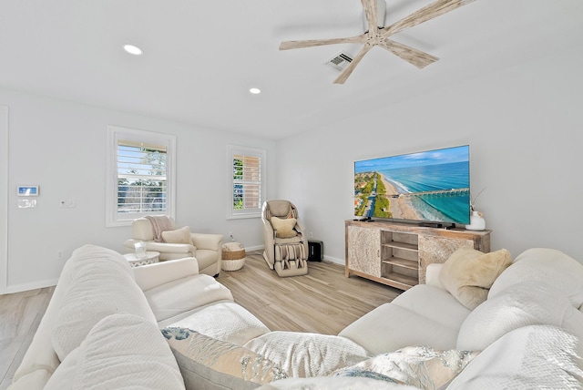 living area with visible vents, baseboards, recessed lighting, wood finished floors, and a ceiling fan