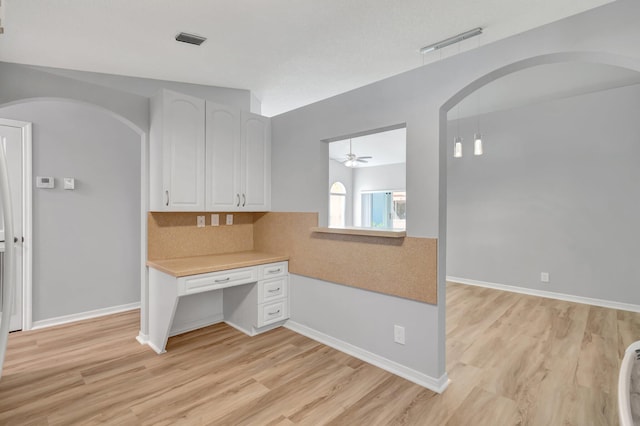 15443 Floral Club Rd, Delray Beach, FL 33484 - unfurnished office with arched walkways, visible vents, light wood finished floors, and ceiling fan