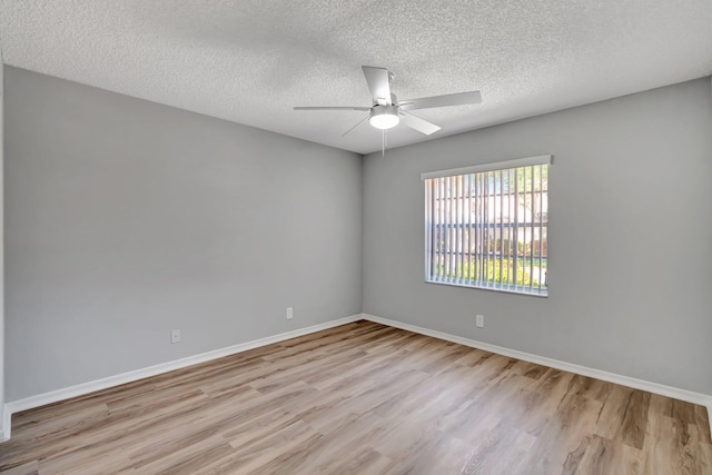 15443 Floral Club Rd, Delray Beach, FL 33484 - unfurnished room with a textured ceiling, wood finished floors, baseboards, and ceiling fan