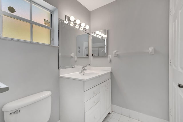 15443 Floral Club Rd, Delray Beach, FL 33484 - bathroom with tile patterned floors, baseboards, toilet, and vanity