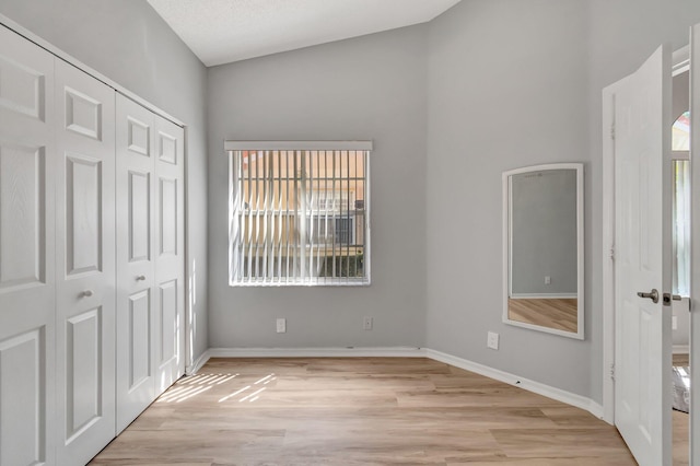 15443 Floral Club Rd, Delray Beach, FL 33484 - unfurnished bedroom featuring a closet, baseboards, and light wood finished floors