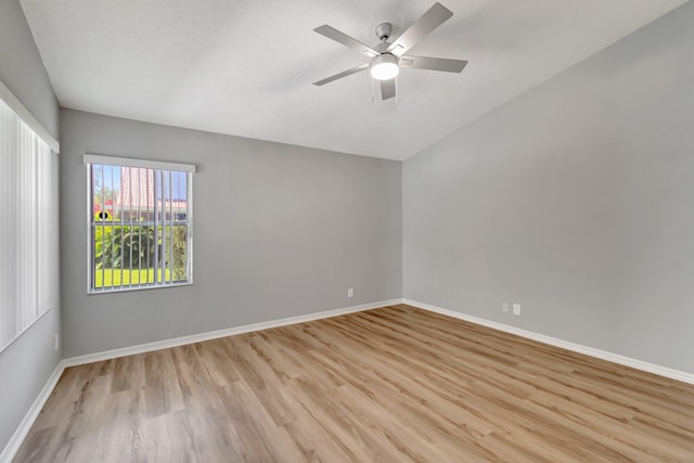 15443 Floral Club Rd, Delray Beach, FL 33484 - spare room with a textured ceiling, wood finished floors, baseboards, and ceiling fan