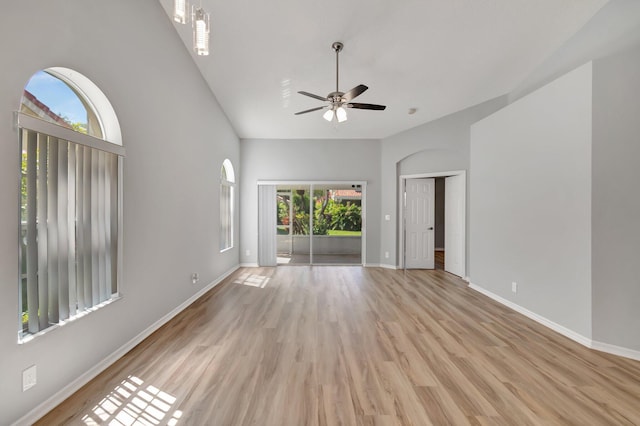 15443 Floral Club Rd, Delray Beach, FL 33484 - spare room featuring a high ceiling, light wood-style flooring, a ceiling fan, and baseboards