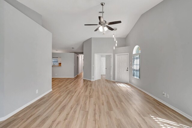 15443 Floral Club Rd, Delray Beach, FL 33484 - unfurnished living room with light wood finished floors, plenty of natural light, baseboards, and a ceiling fan