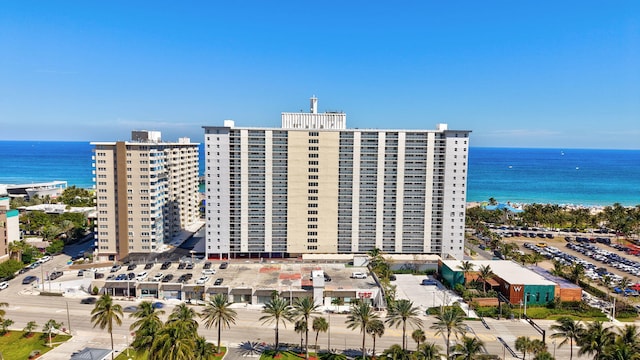 view of building exterior with a city view and a water view