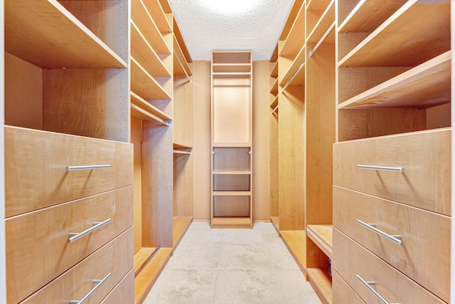 walk in closet featuring tile patterned floors