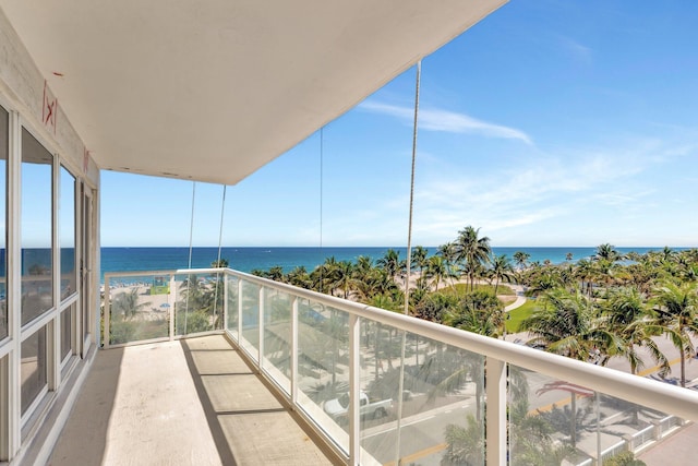 balcony featuring a water view