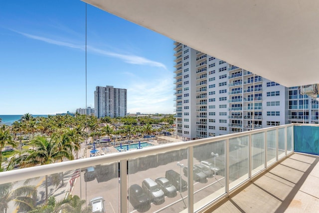 balcony featuring a view of city and a water view