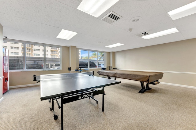 playroom featuring visible vents, light carpet, and baseboards