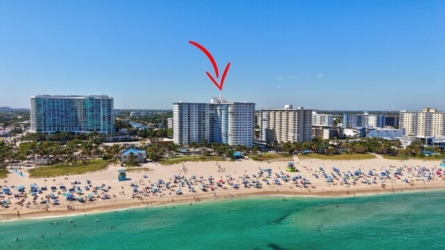 aerial view with a view of city, a beach view, and a water view