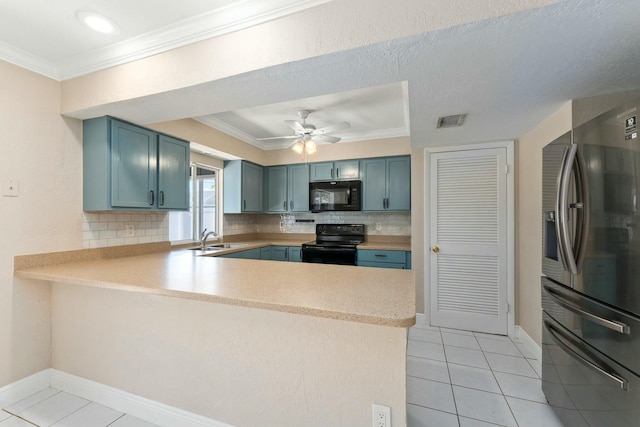 kitchen with visible vents, light countertops, ornamental molding, a peninsula, and black appliances