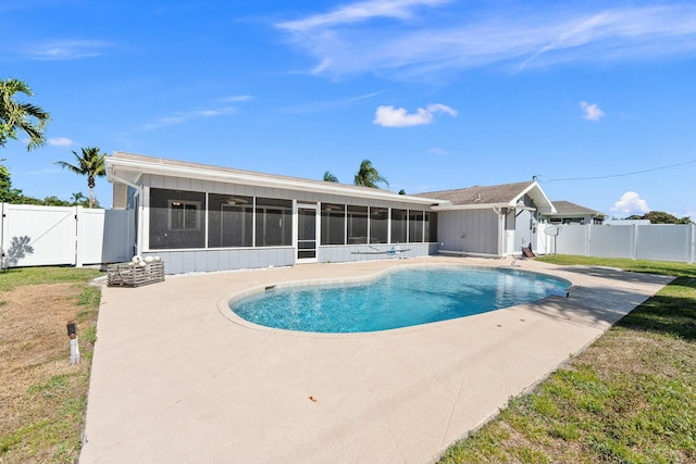 view of swimming pool with a patio, a gate, a fenced backyard, and a sunroom